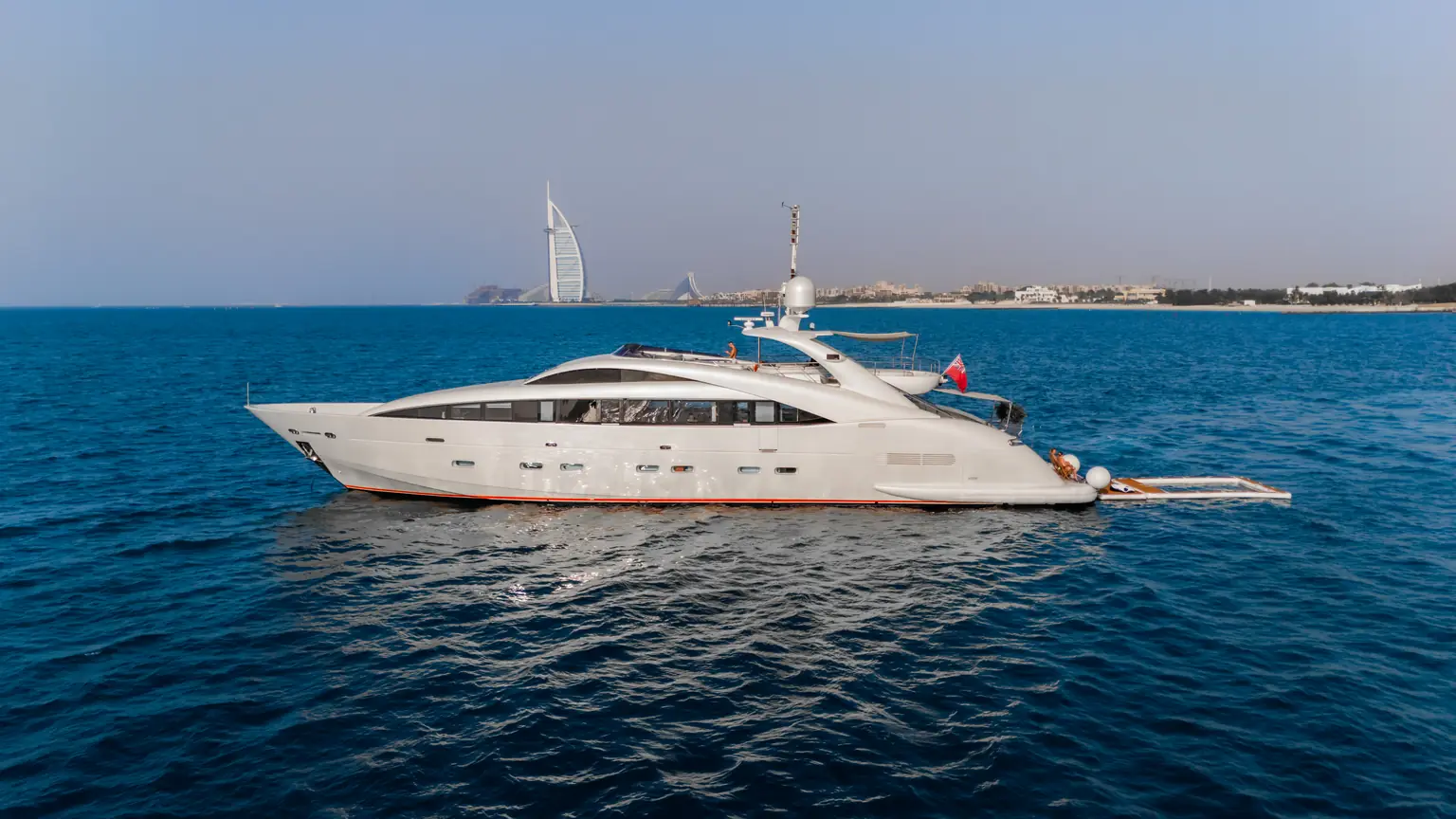 Starboard profile of Plan B of Freedom with the Burj Al Arab in the distance