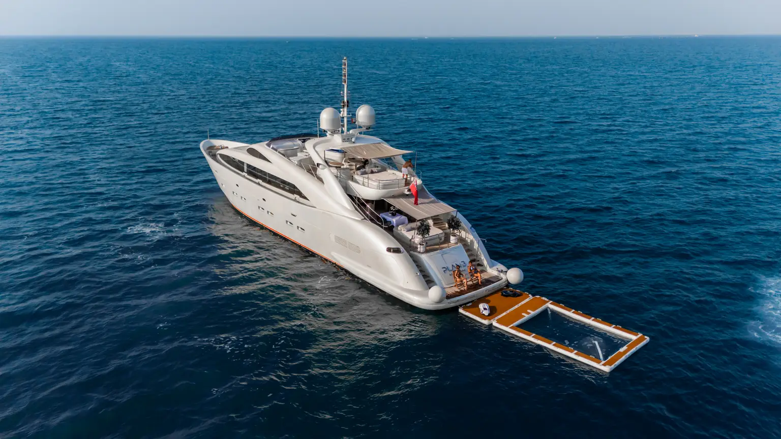 Floating sea pool rigged off the stern of Plan B of Freedom for swimming