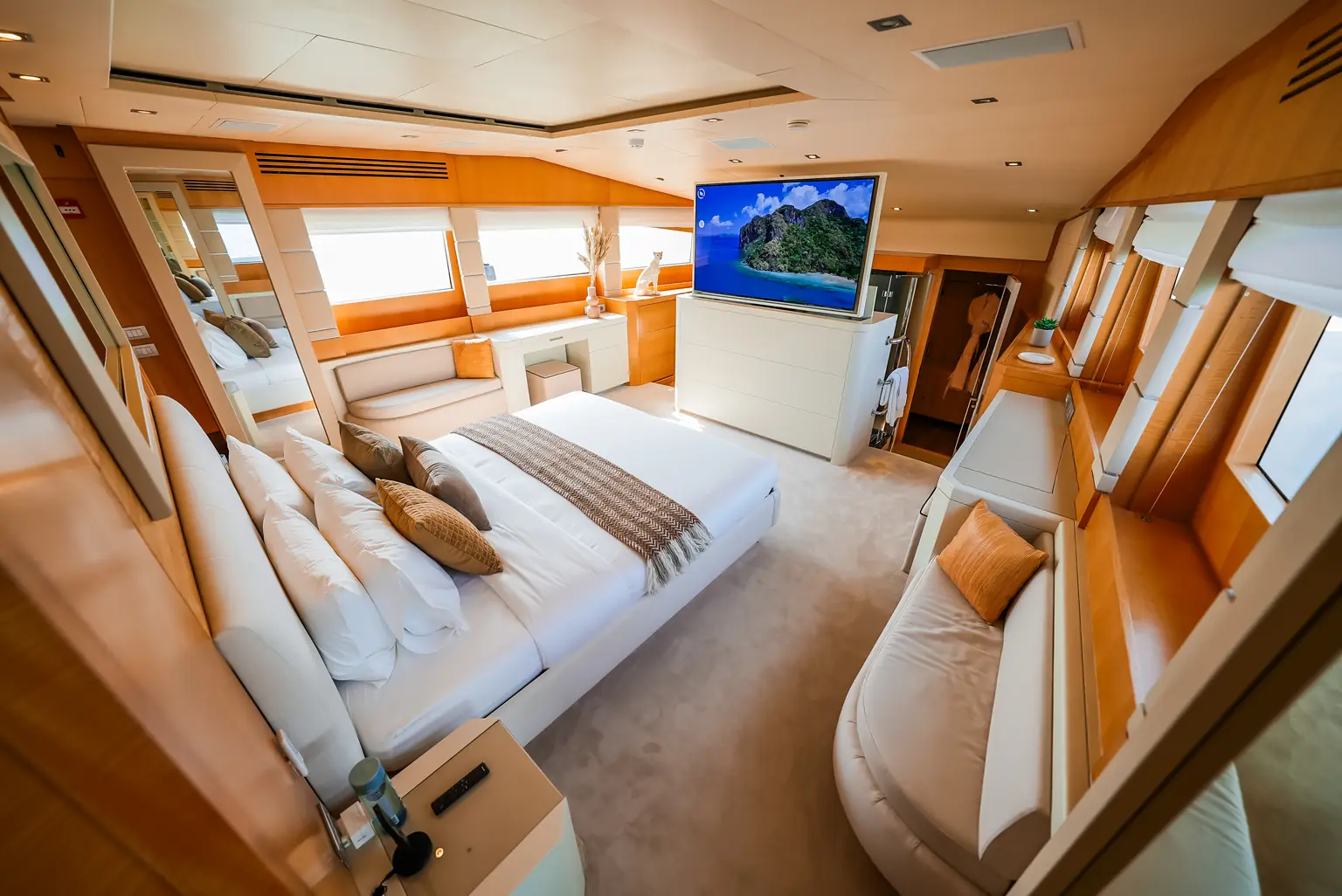Owner's cabin aboard Plan B of Freedom, with a double bed and windows to both sides